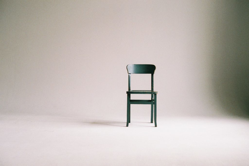 Green Wooden Chair in white empty room 