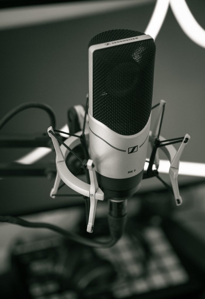 Selective Focus Photography of greyscale Condenser Microphone
